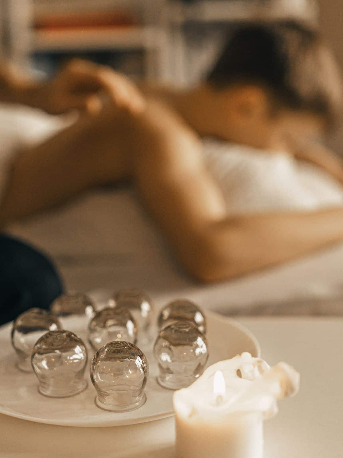 Cupping Devices with Person in Background